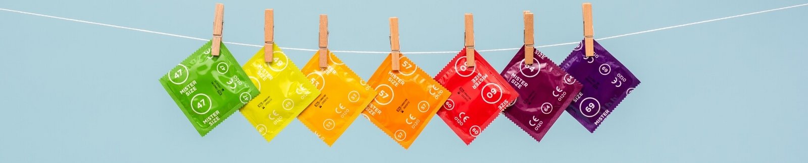 Mister Size condoms in different sizes on a line